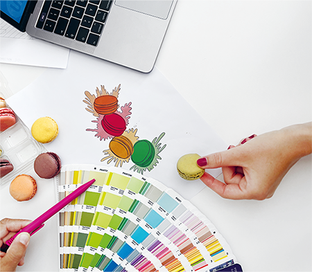 On the table, color fan, photo of macarons, the real macaron product.